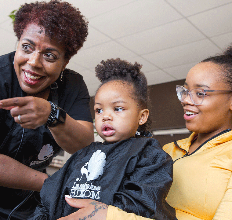 Mother and daughter receiving curl coaching